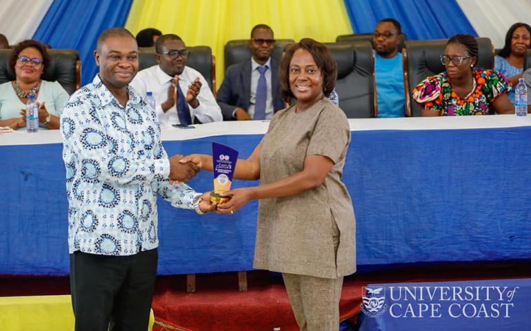 Prof. Desmond Omane Acheampong honouring Dr. Hannah Benedicta Taylor-Abdulai from the department of Physician Assistant Studies.